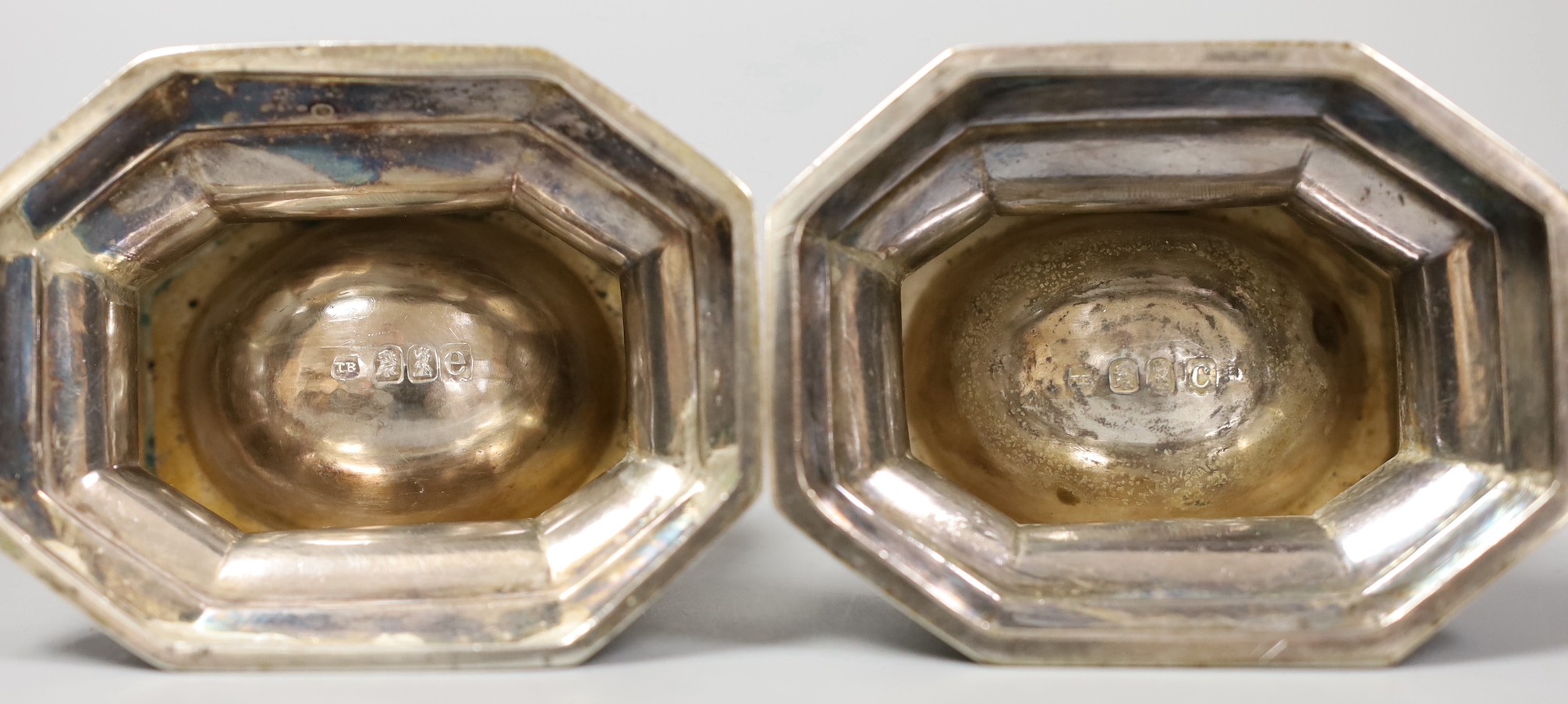 A pair of late Victorian Britannia standard silver trencher salts and pair of matching sterling silver spoons, Thomas Bradbury & Sons, London, 1897/1900, length 81mm, 140 grams.